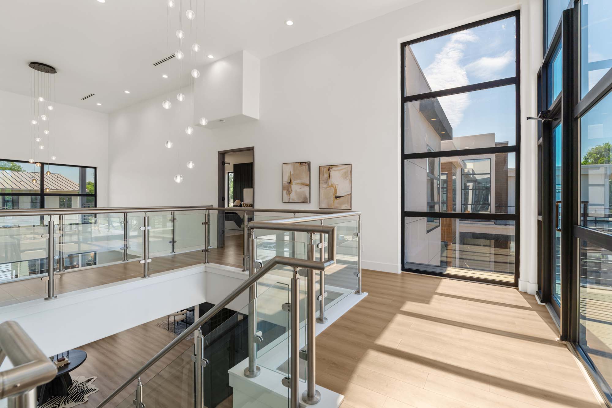 Double-height entry hall with steel-and-glass staircase