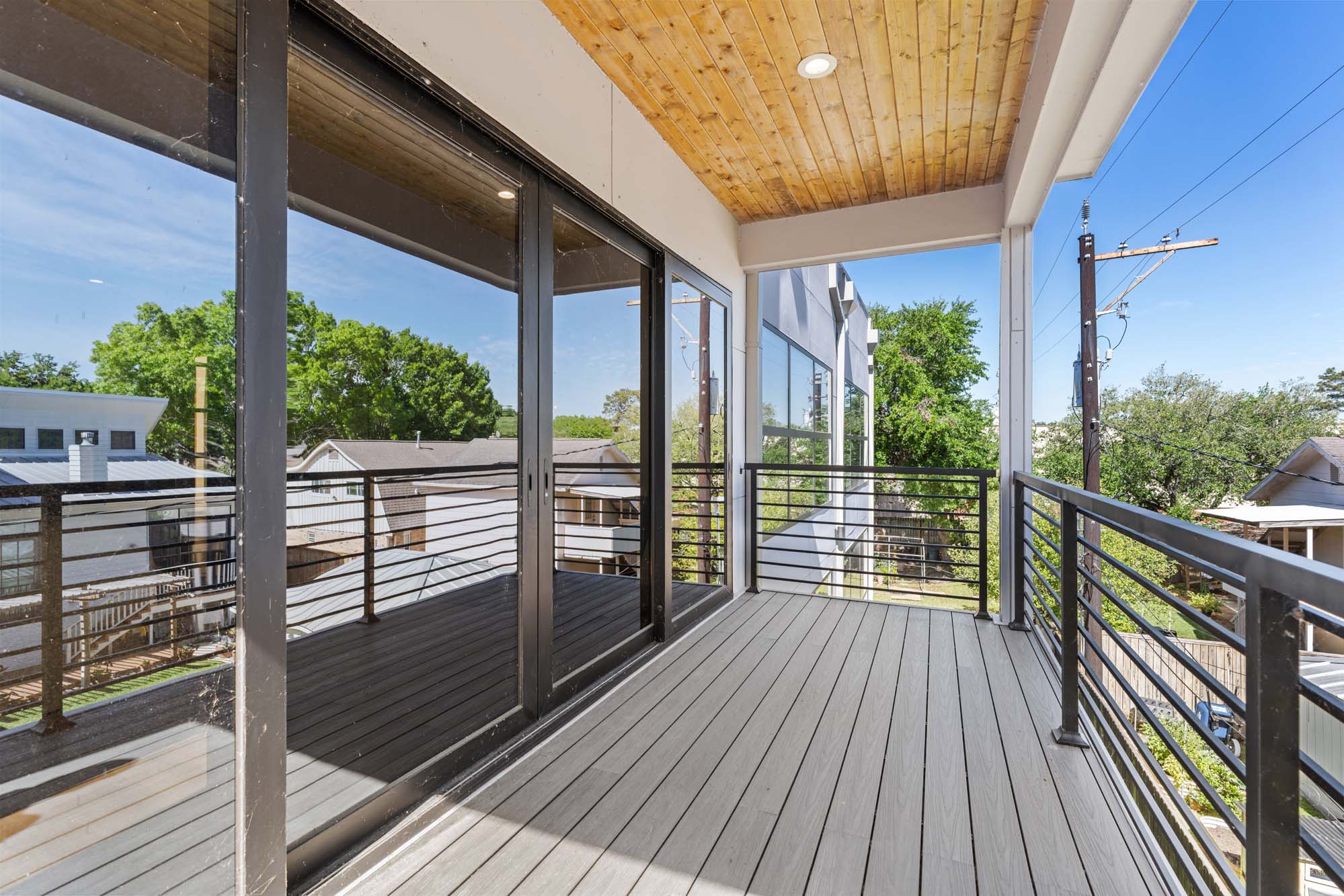 Upper terrace with cedar overhang and treetop views