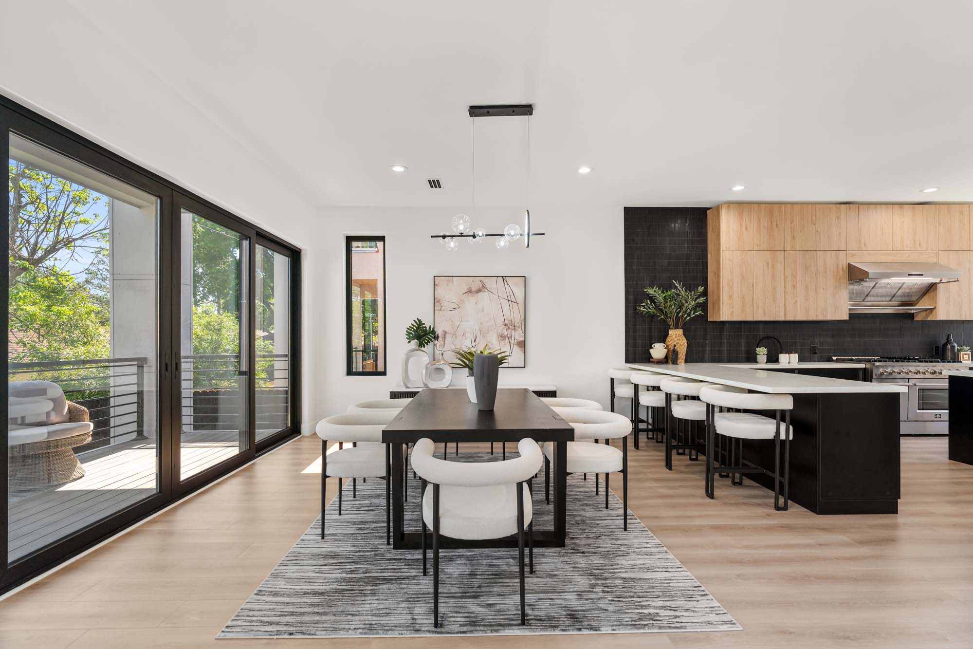 Chef's kitchen with side-by-side refrigeration and waterfall island